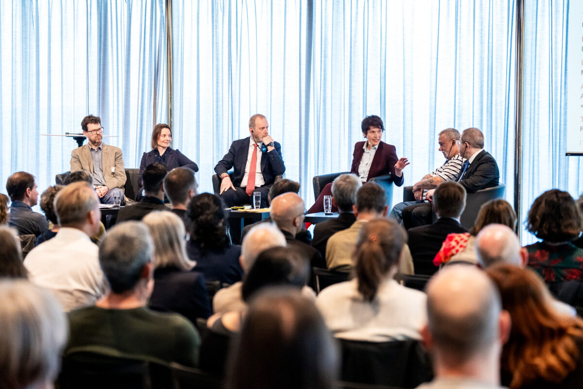 Colour photograph of a panel discussion with five participants and a moderator. This is the closing event of the Swiss National Science Foundation's National Research Programme NFP 76 ‘Care and Coercion’, 24 May 2024.