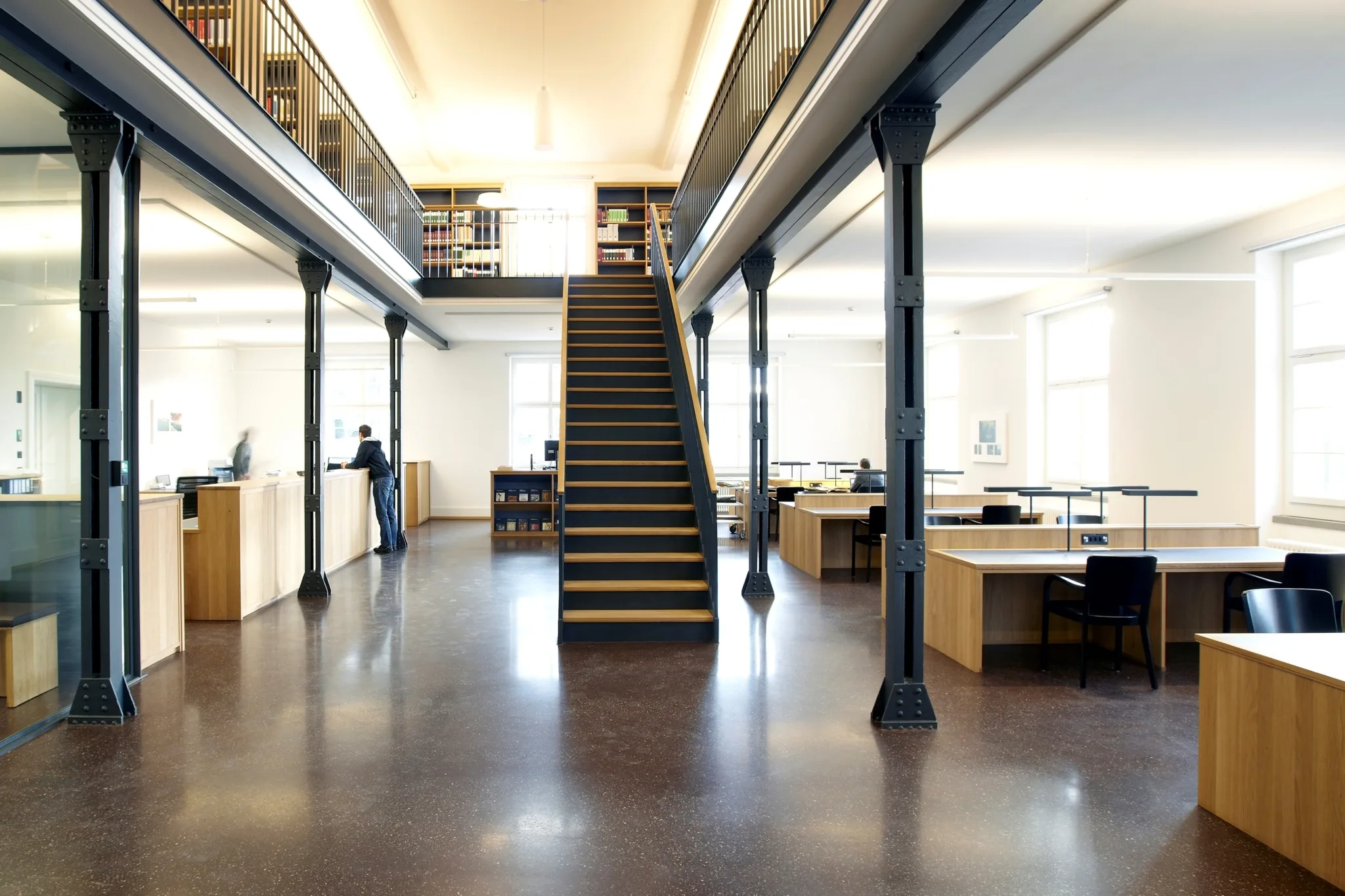 The reading room and library in the new State Archives of the Canton of Thurgau in Frauenfeld, designed by Jessenvollenweider Architecture, invite visitors to read files and explore their own history.